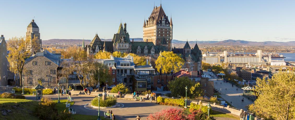 Quebec City in autumn, with the Château Frontenac and colourful trees in the foreground